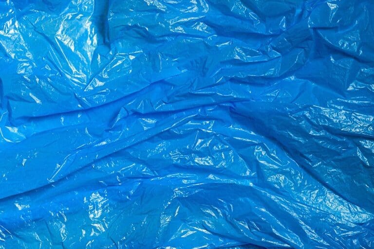 Wrinkled blue plastic texture representing packaging material