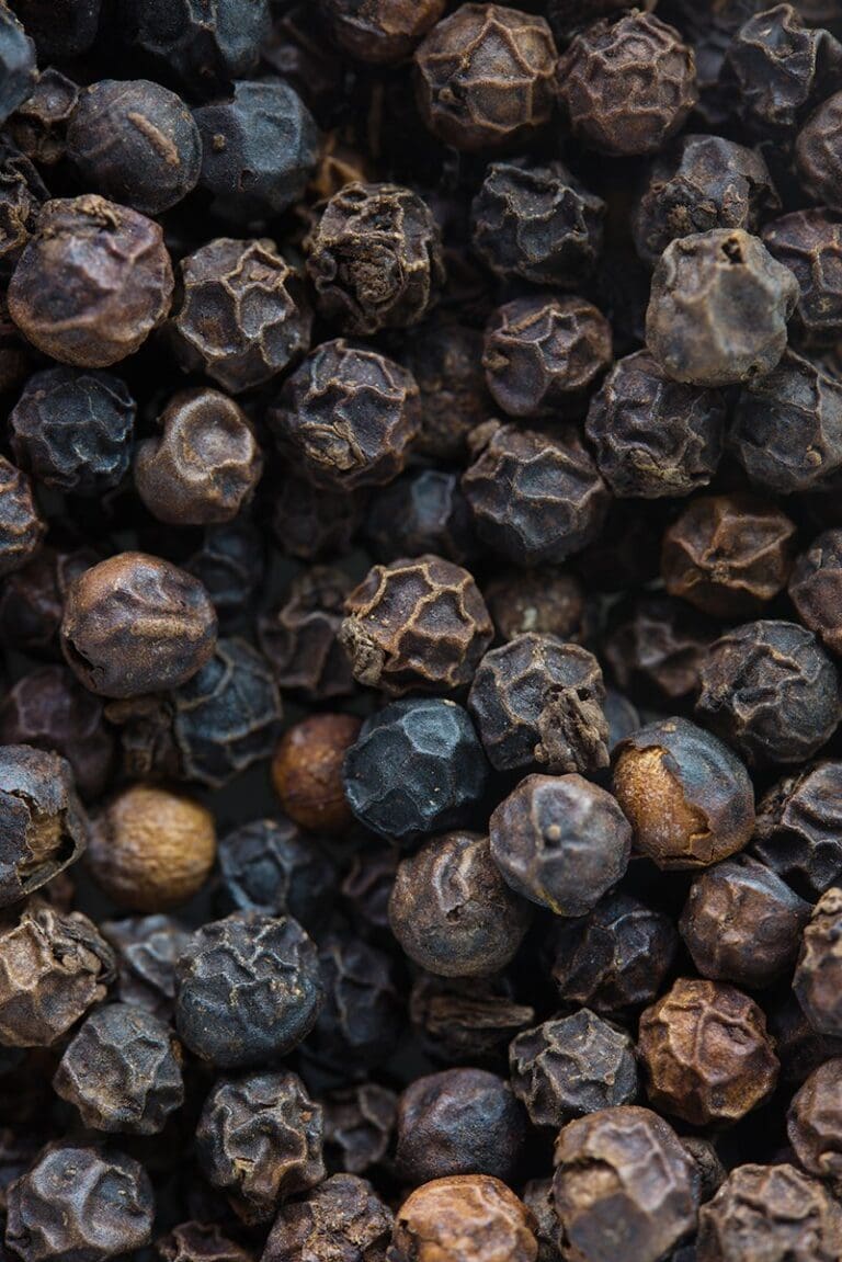 Close up of black peppercorns