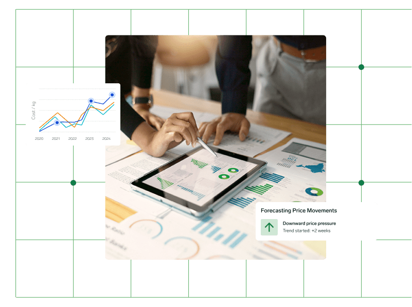 A table covered with paper and a tablet containing graphs